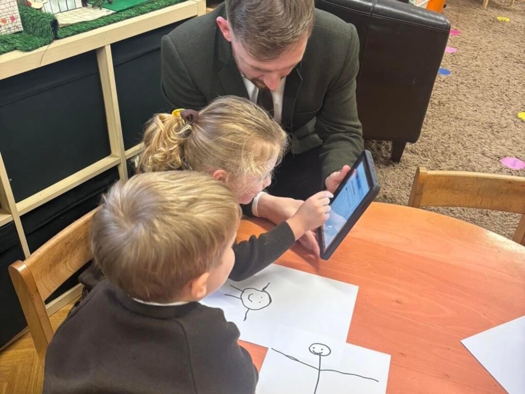 teacher and children using ipad