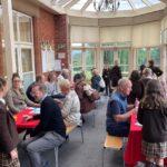 Old Vicarage School parents enjoying a drink in the conservatory